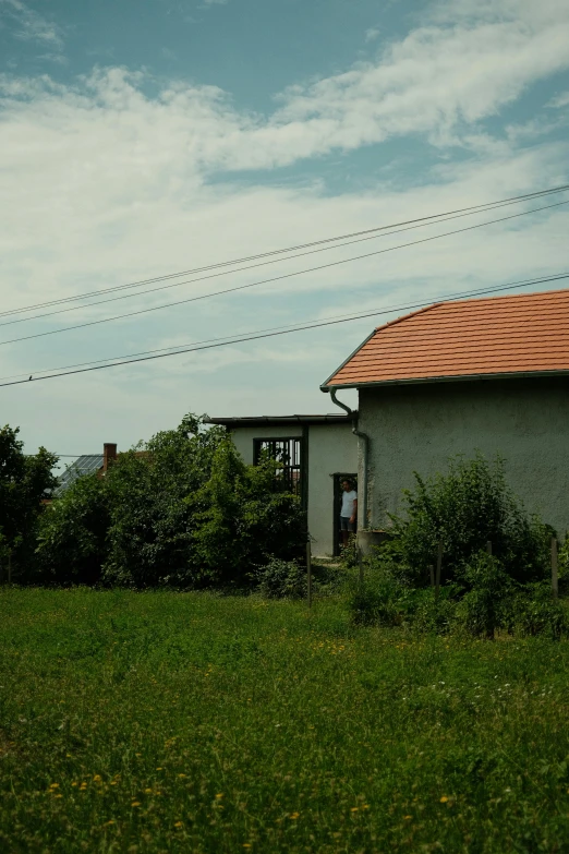 a po of a house with a red roof