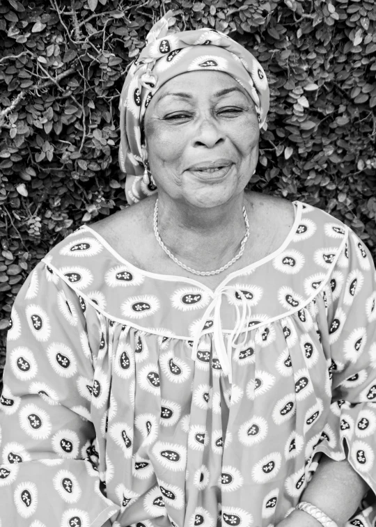 a black and white po of a woman in front of plants