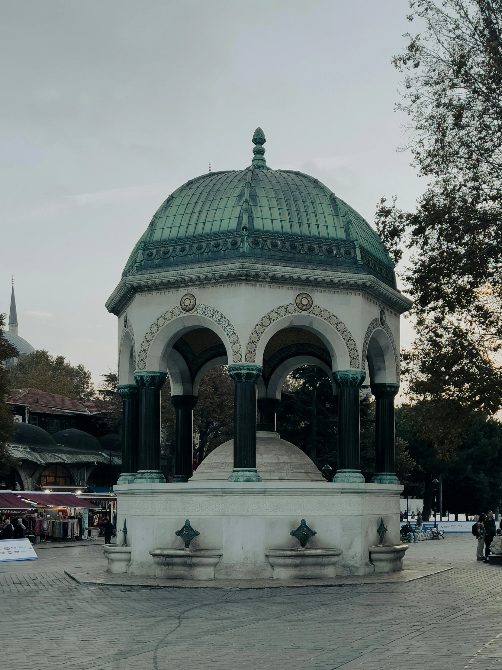 a gazebo with a clock sitting on top of it