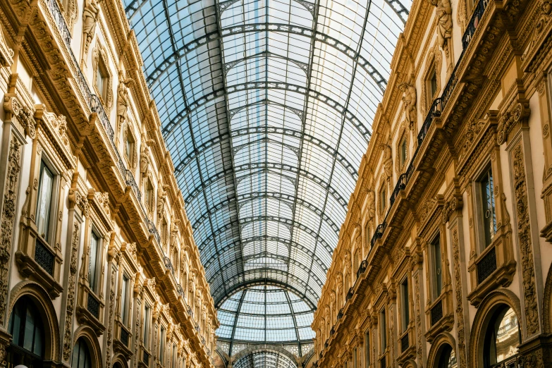 several tall building with glass ceilings in a mall