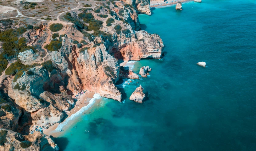 an aerial view of an island next to the ocean