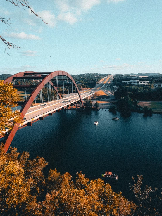 a bridge that has some boats going on it