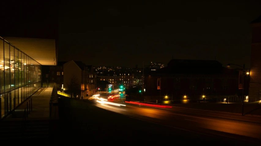 a view of an urban street in the night