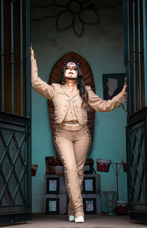 a woman in a sombrero standing on a porch