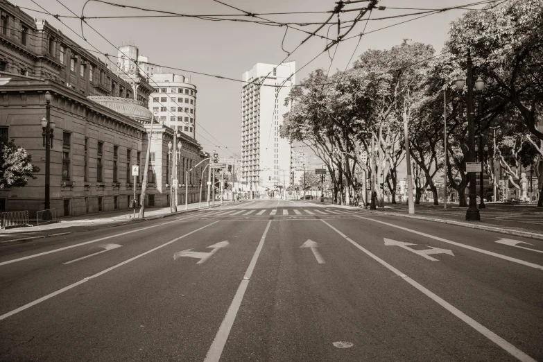 a street with traffic and buildings in the background