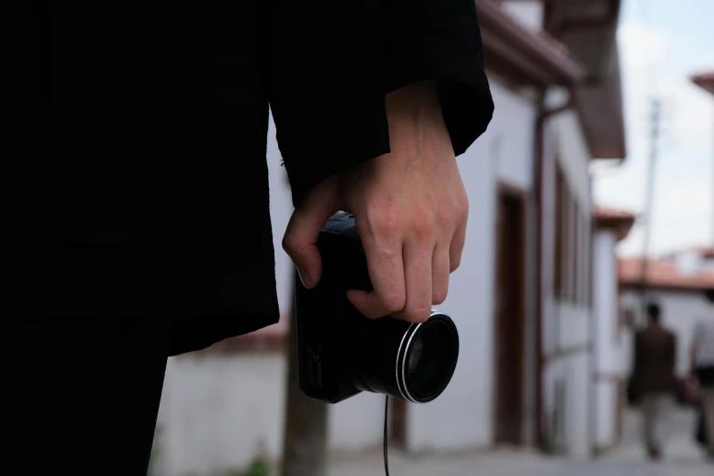 a person holding the handle of an object outside