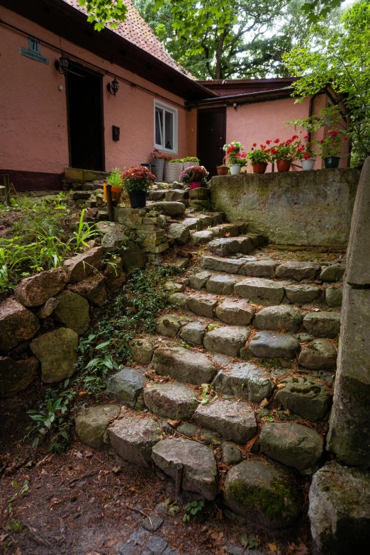 a very large stone staircase in front of a house