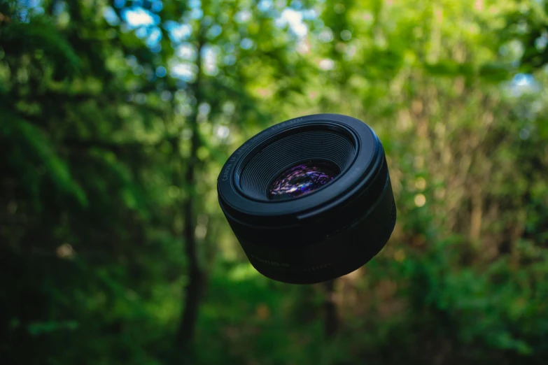 an image of a lens on a tripod in the air