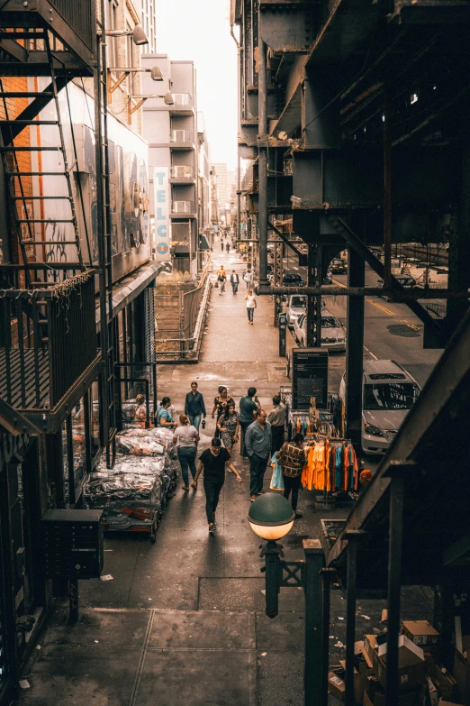 there are people walking down this alley way