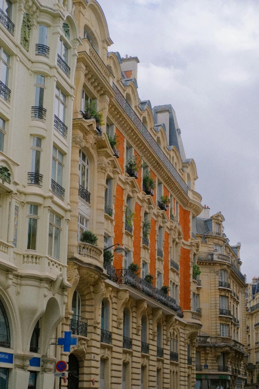 rows of older buildings are shown along a street