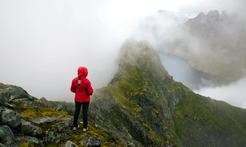 a man on top of a large hill standing