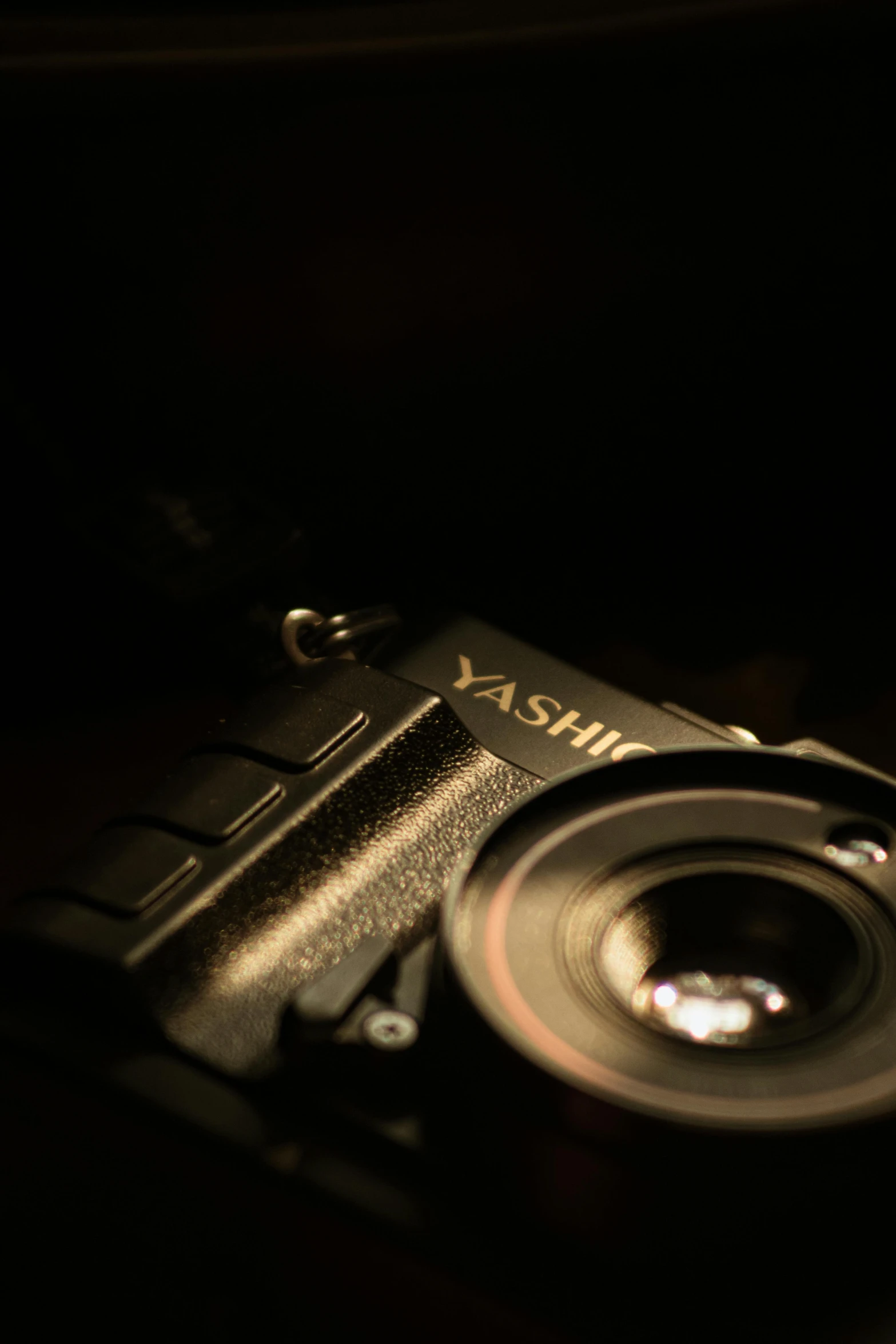 a digital camera sitting on top of a wooden table