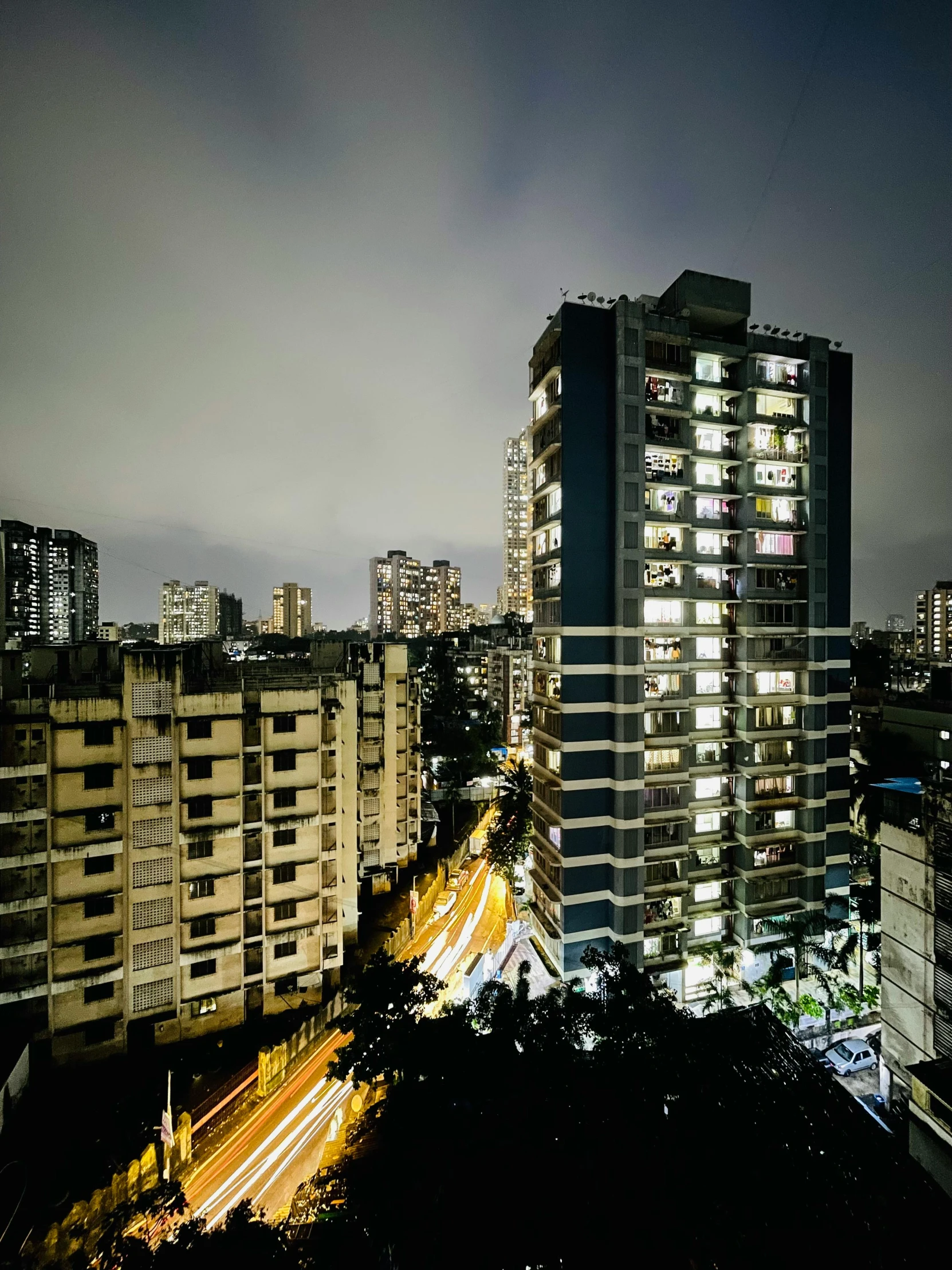 night in a big city with lights, cars and buildings