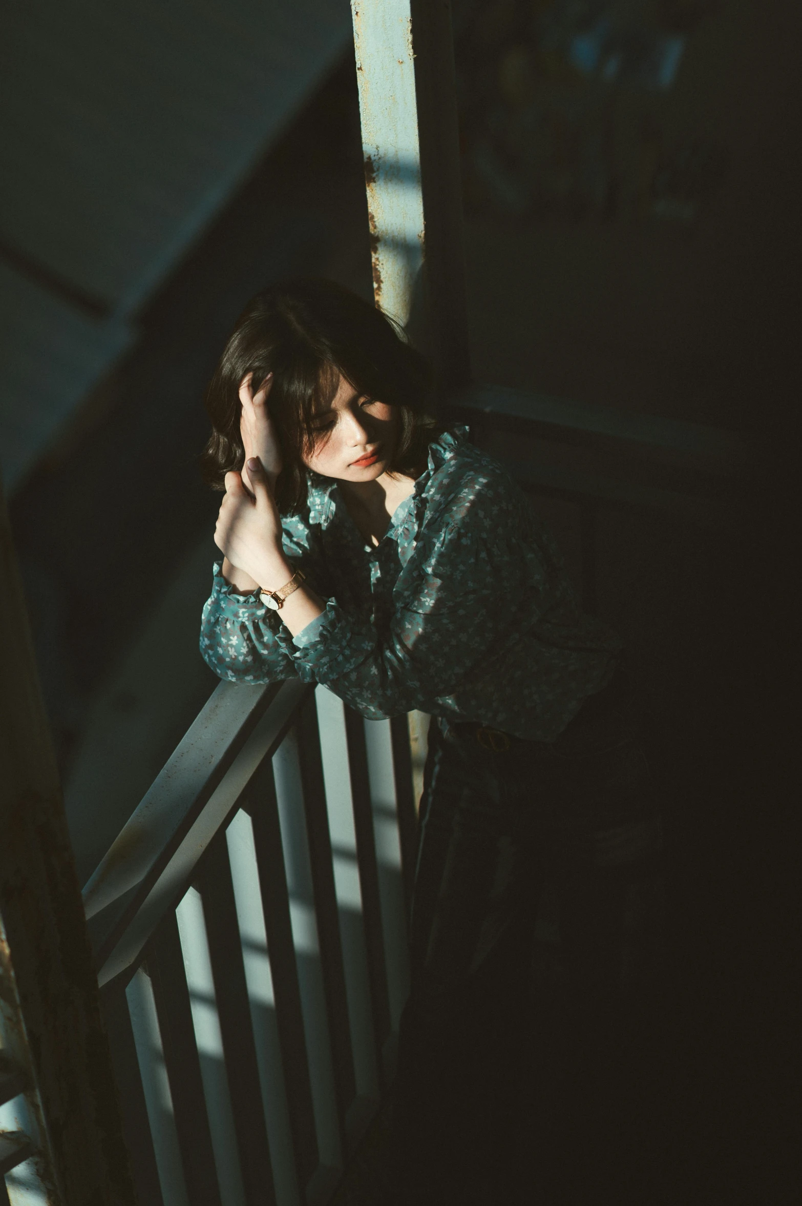 a woman holding her face to her right