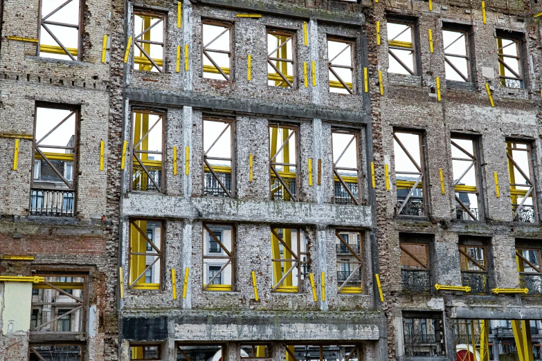 several windows in the side of a tall building