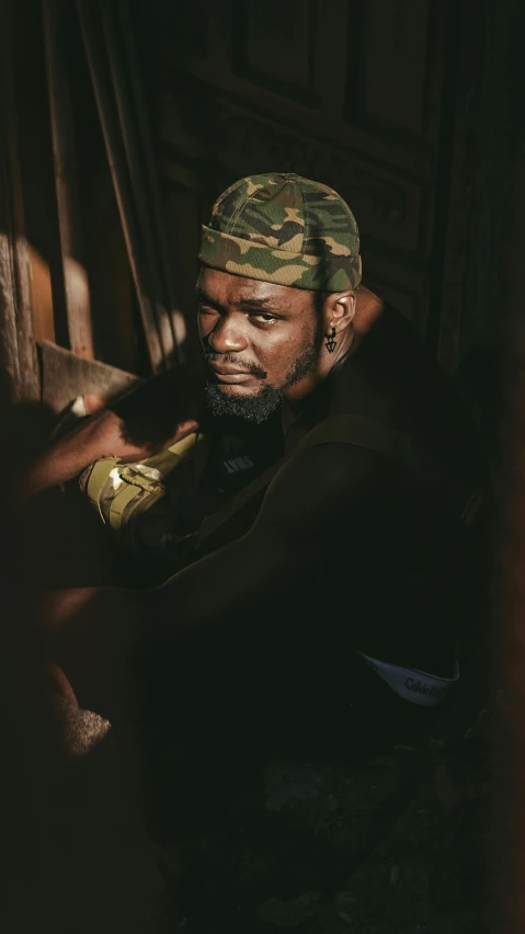 a man in a military uniform looks away from the camera