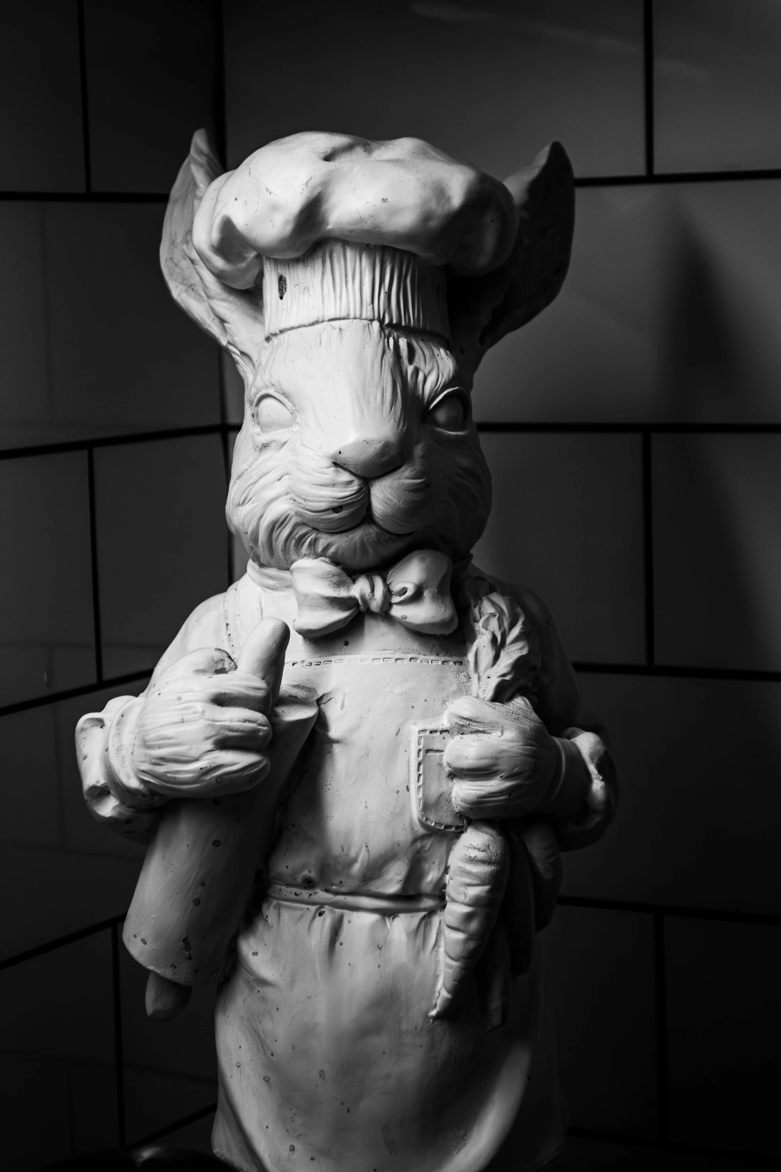 a black and white po of a statue of a rabbit