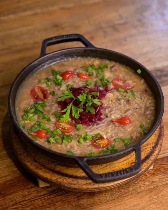 bowl with beans, tomatoes and greens on it