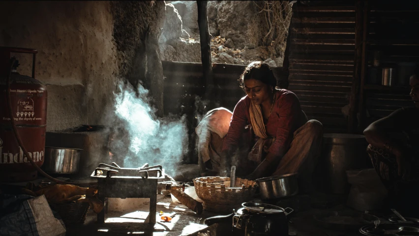 a woman is preparing food in her kitchen