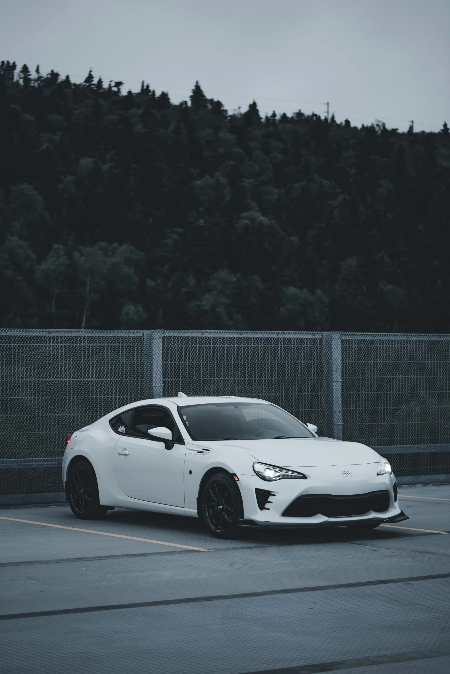 a white car parked in a parking lot