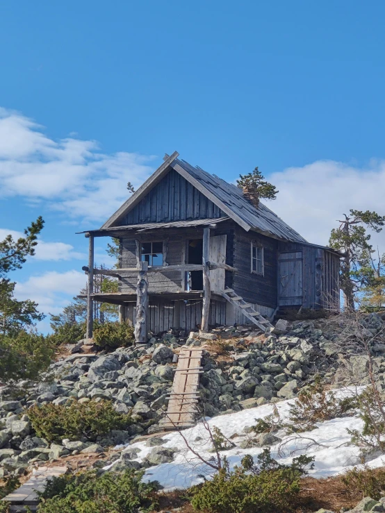 a very old house perched on a hill