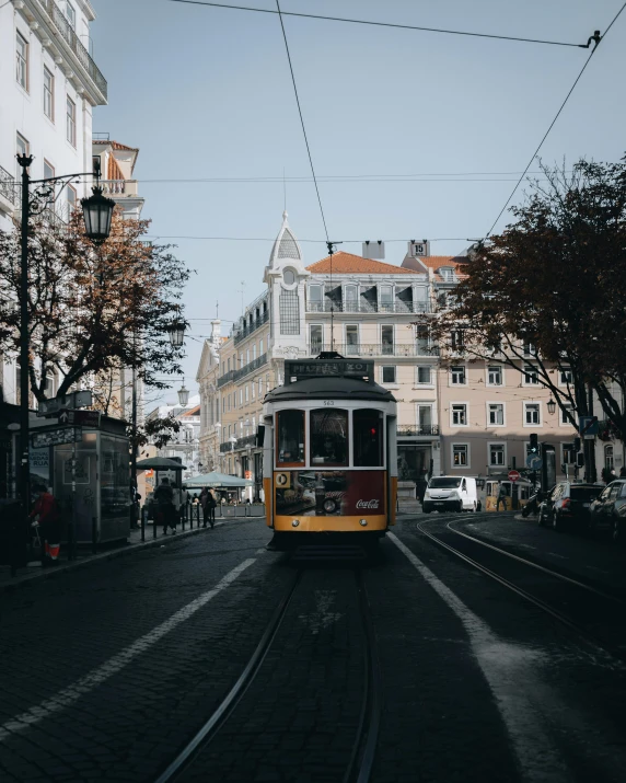 there is a trolley in the middle of this city street