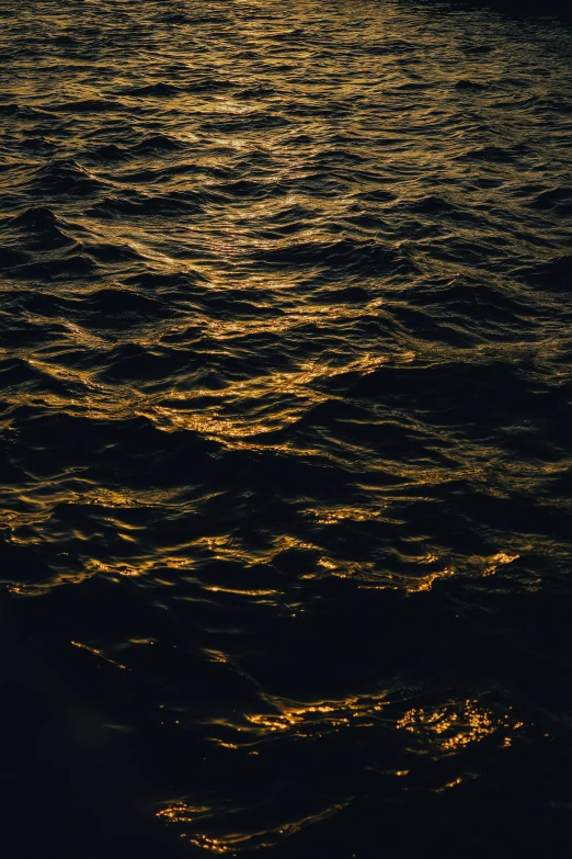 a person on surfboard at night in the water