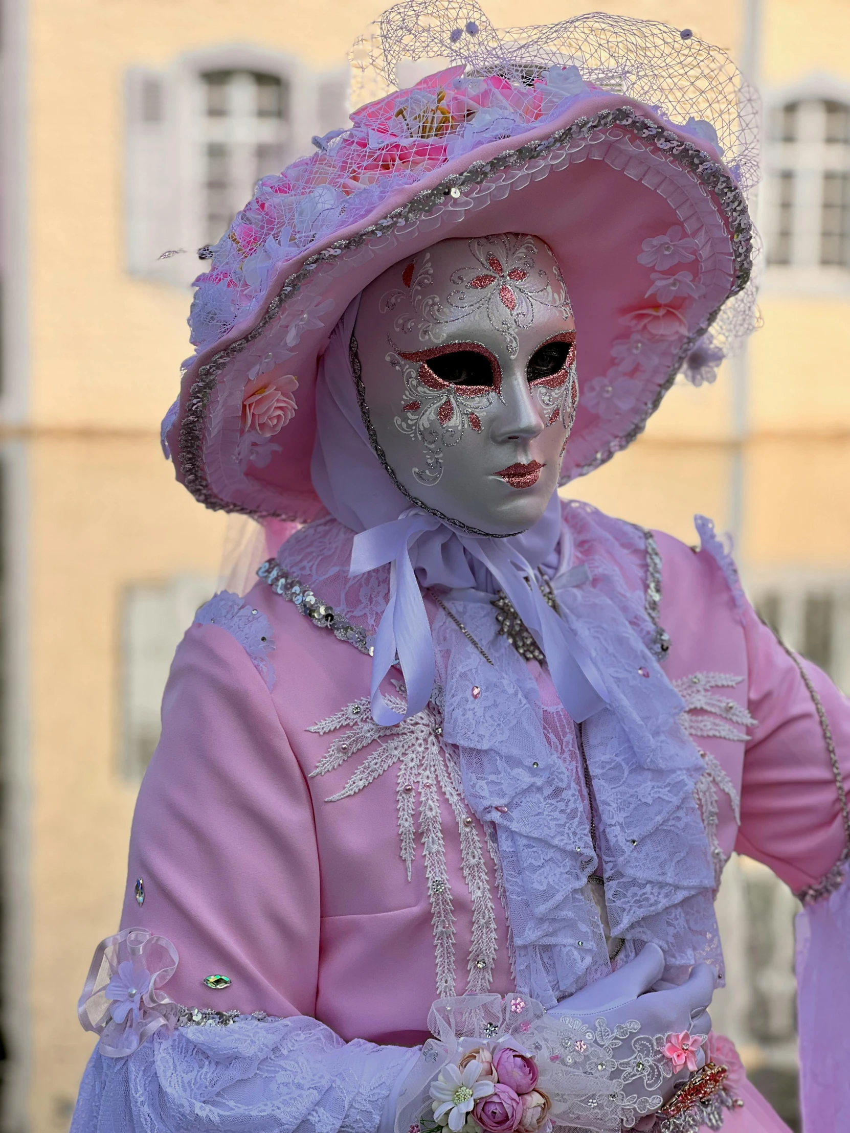 a person with a big hat on and colorful makeup