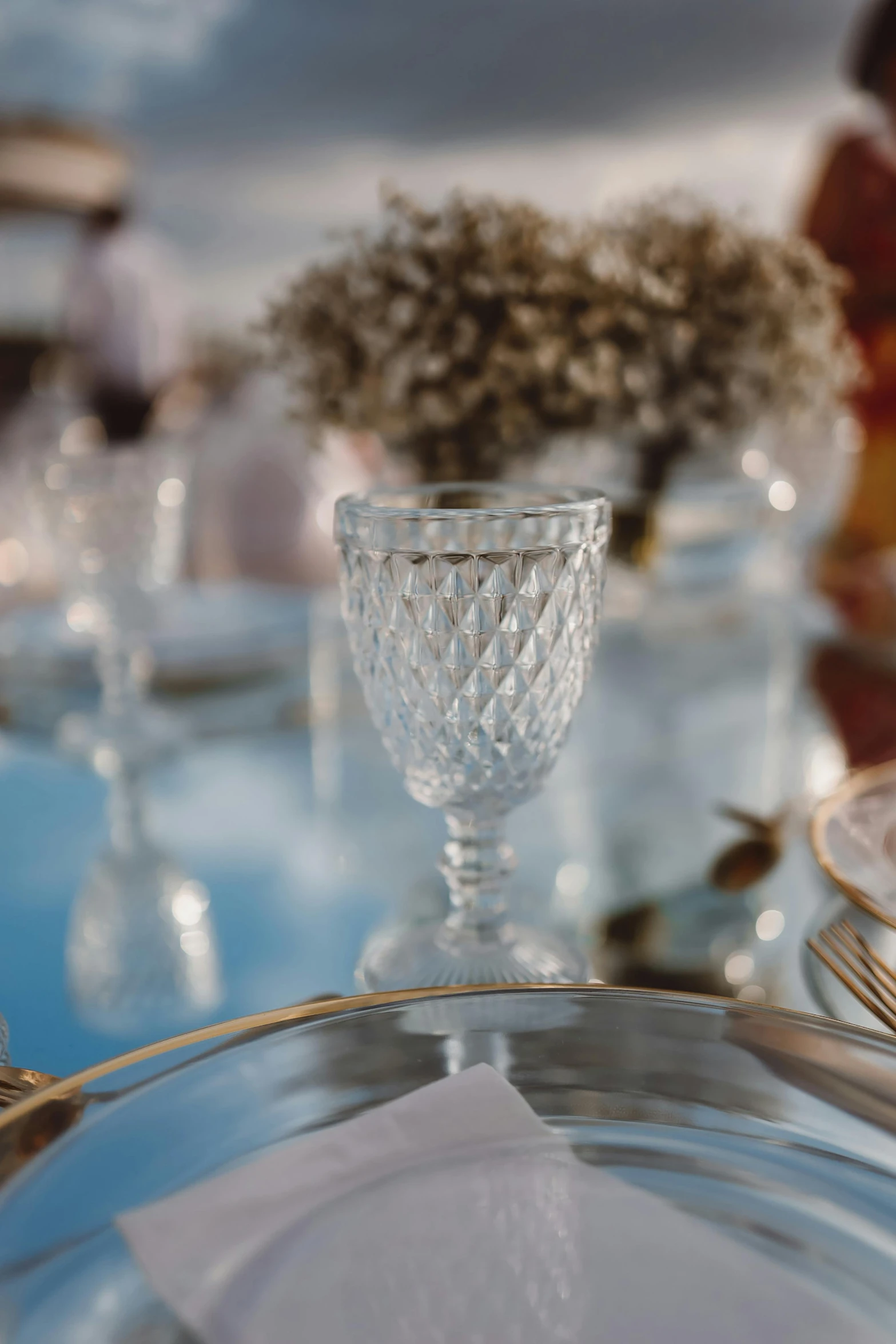 a glass is sitting on a glass table