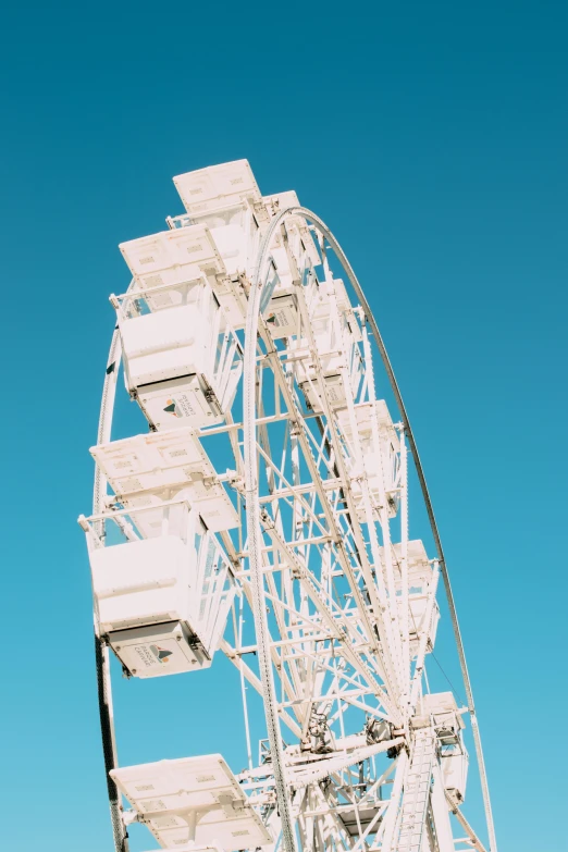 a giant ferris wheel in front of the ocean