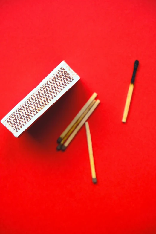 matches and match stick on a red background