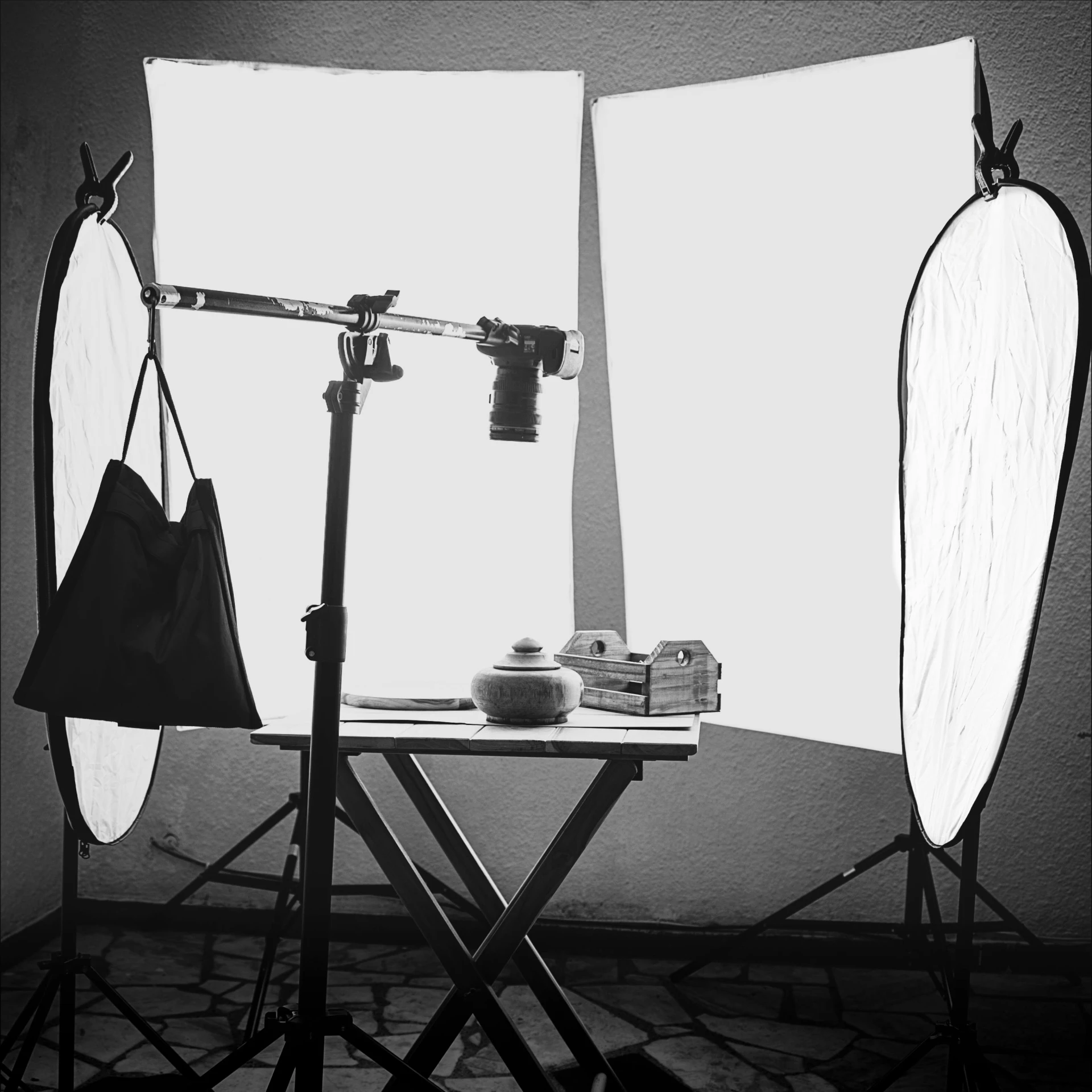 a black and white po of a pographer setting up his equipment