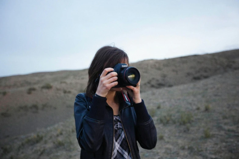 a woman taking a picture with her camera