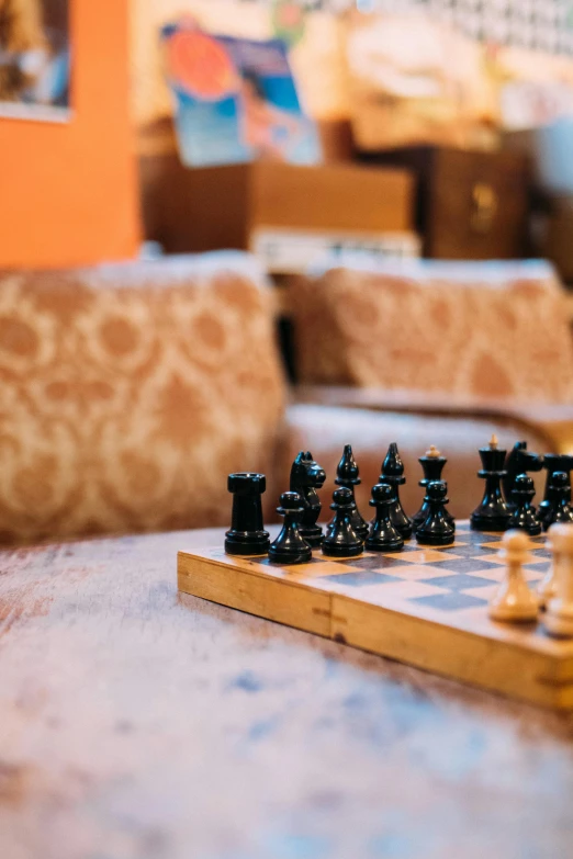 black chess on wooden table in living room