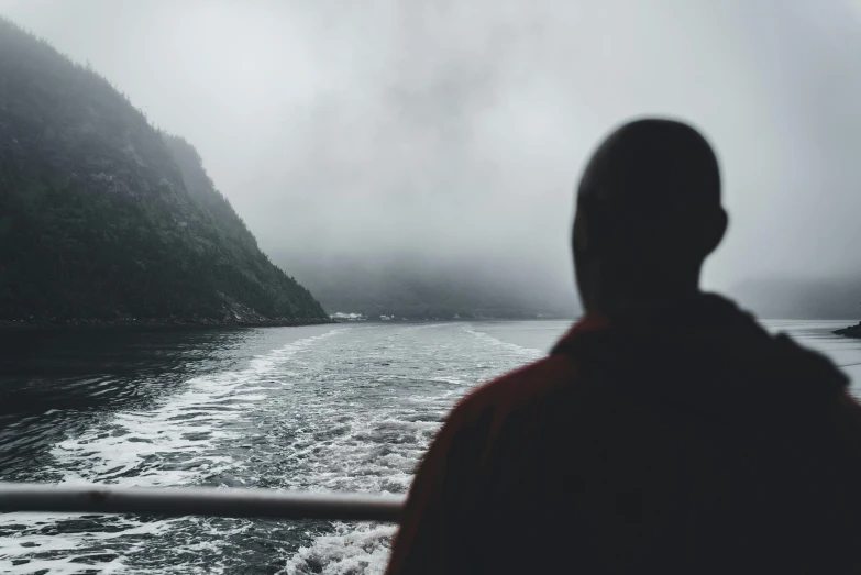 a person standing on a boat in the water