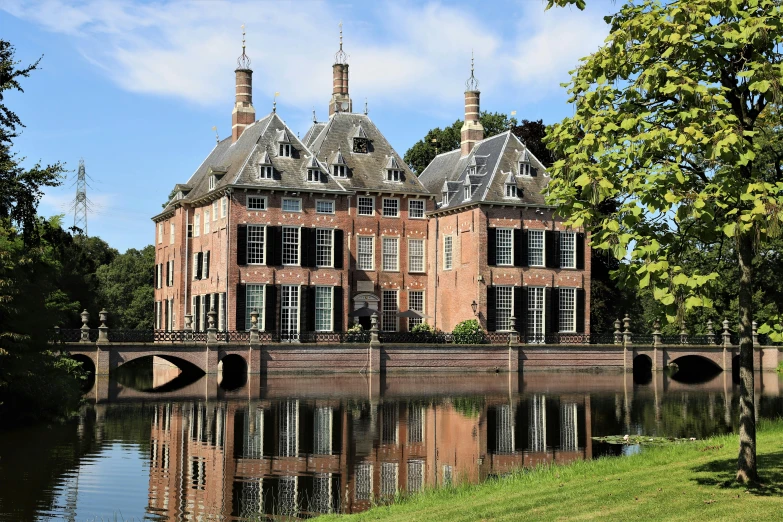 the side view of a building by a lake