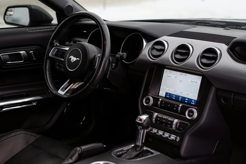 a picture of a car dashboard showing a screen with an ipod