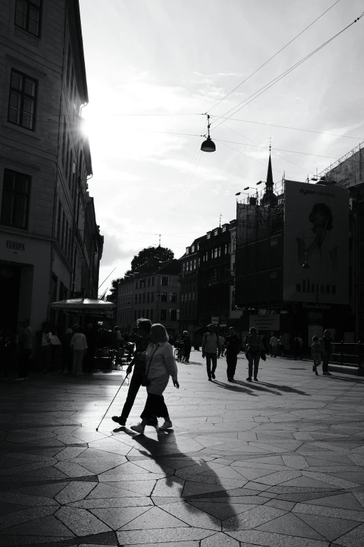 a man riding a pair of skis down a city street