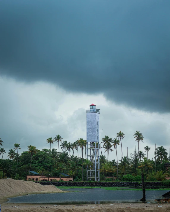 a large tall tower with a red and white flag on it's top