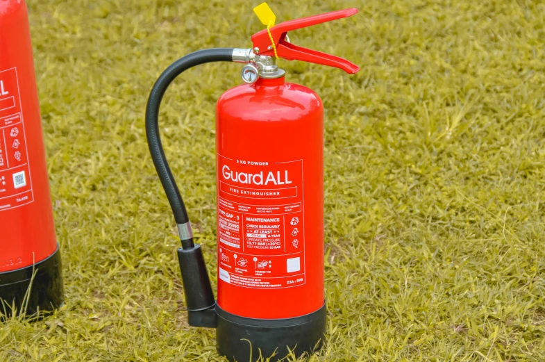 a small fire extinguisher and hose attached to a larger propane