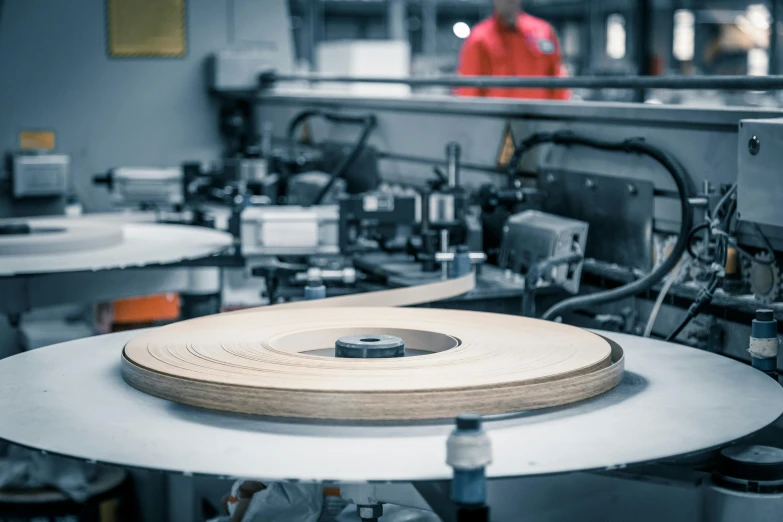 a machine is working with tape for sewing