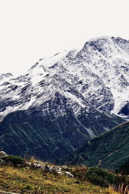 a white snow covered mountain in the distance