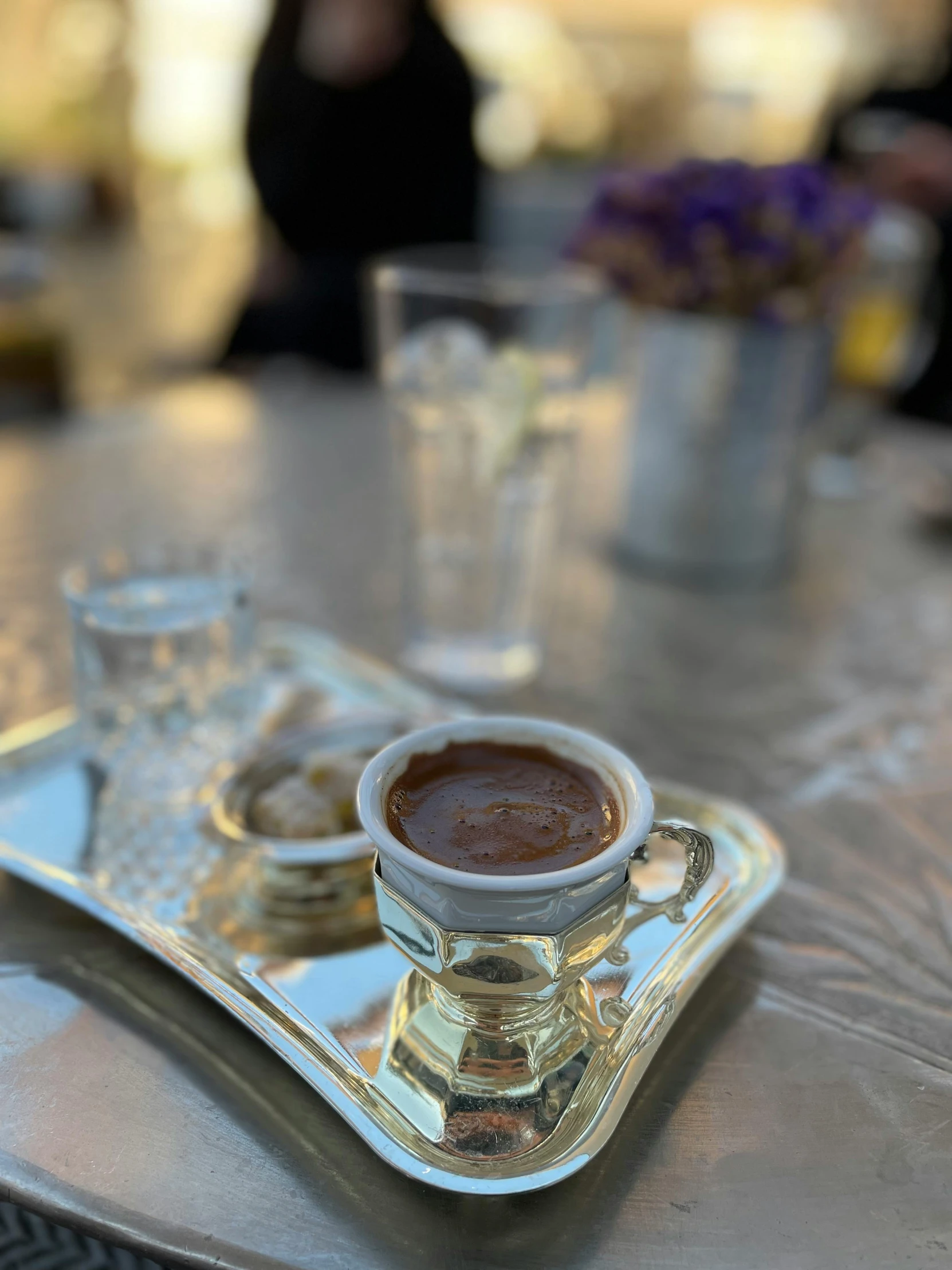 a tray full of some kind of sauce on a table