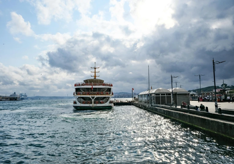 a large boat traveling past another boat on the ocean