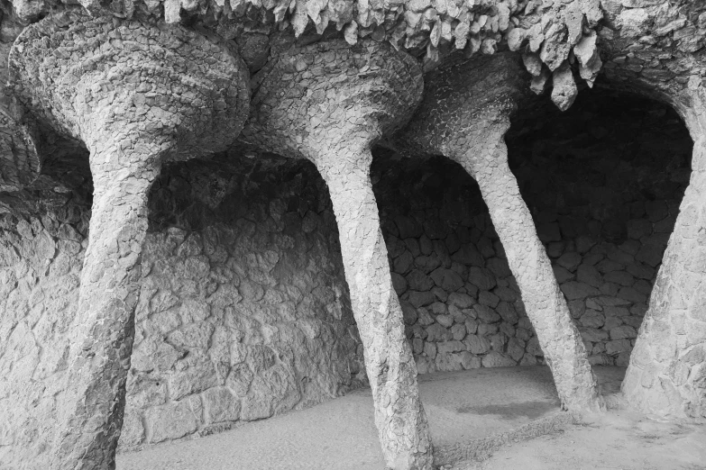 a stone building with four tree shaped trees growing out of it