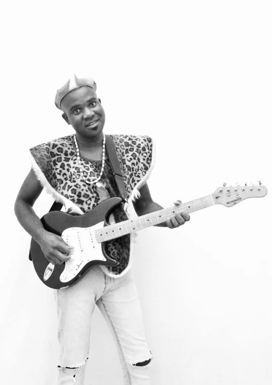 a man with a guitar posing for a po