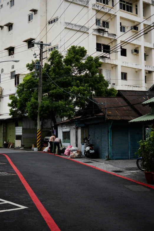 a street view of houses and buildings in an asian city