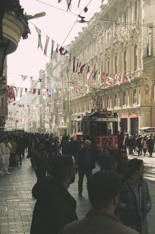 a street in the city with lots of people walking