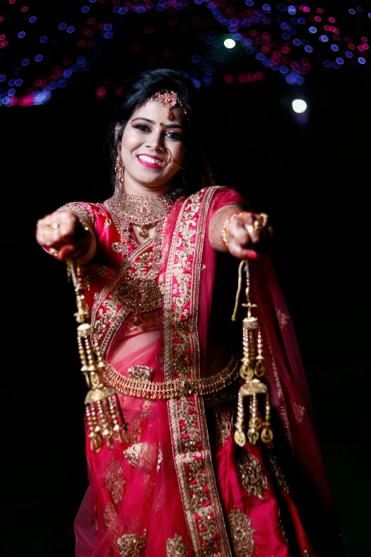 an indian woman in red traditional bridal attire