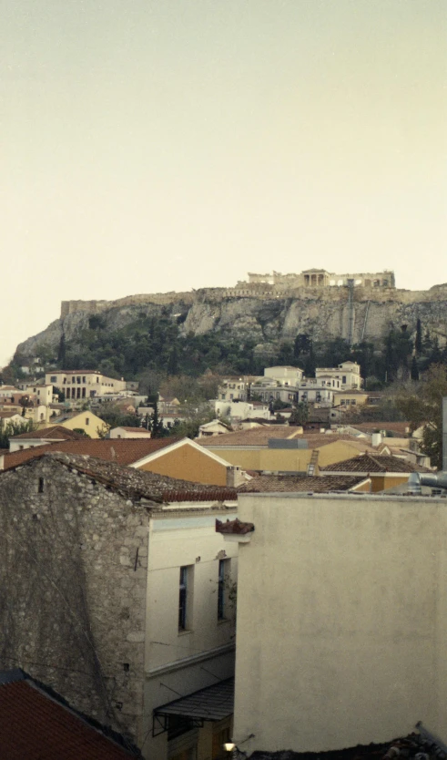 a mountain with white buildings on a hillside